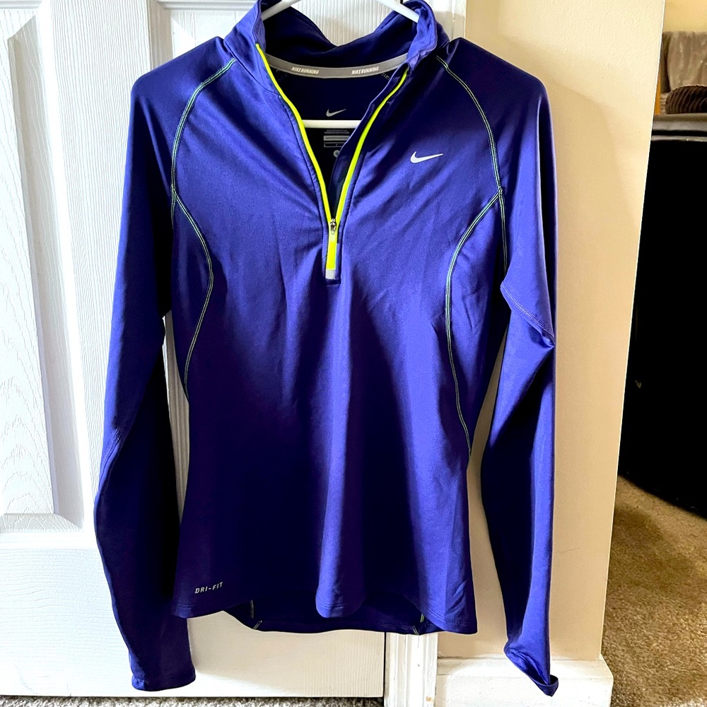 Nike DriFit woman’s long sleeve jogger. Half zip.